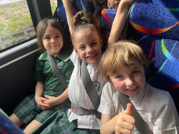 Three students on a bus